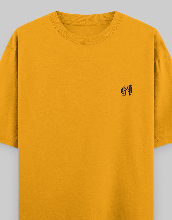 Golden yellow oversized unisex t-shirt with black chest logo on plain background