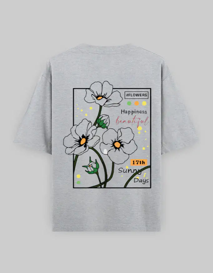 Gray oversized unisex t-shirt with graphic white flowers and text, streetwear style.