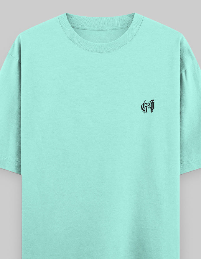 Mint green oversized unisex t-shirt with small black graphic on chest, streetwear style